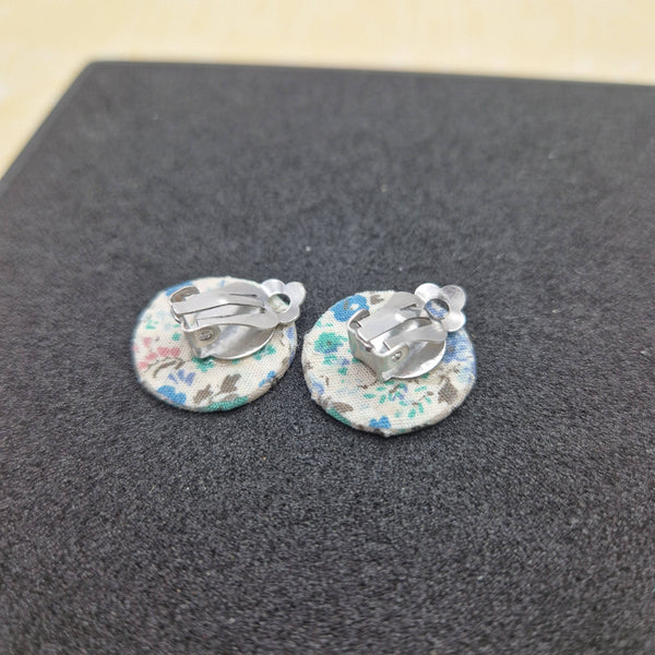 Blue circle floral clip on earrings