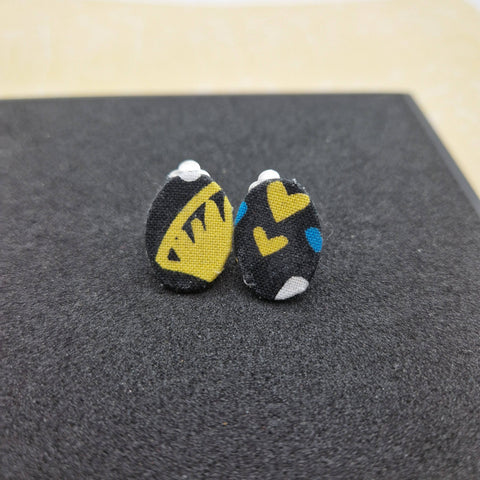 Black ovals with yellow and blue bold clip on earrings