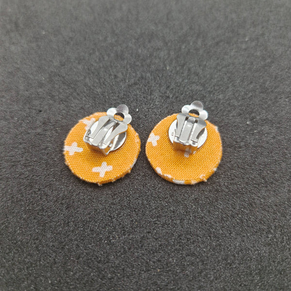Orange hexagonal clip on earrings