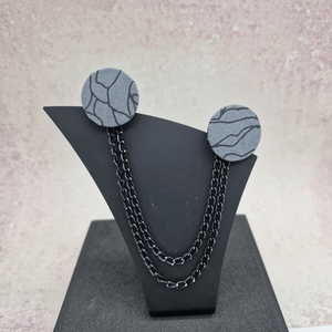 Black, white and grey Collar pins with black chain.