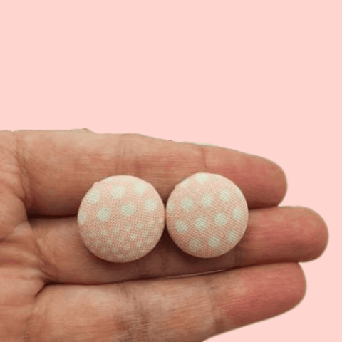 Pink and White button studs.