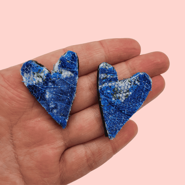 Blue upcycled fabric collar pins with removable black chain.