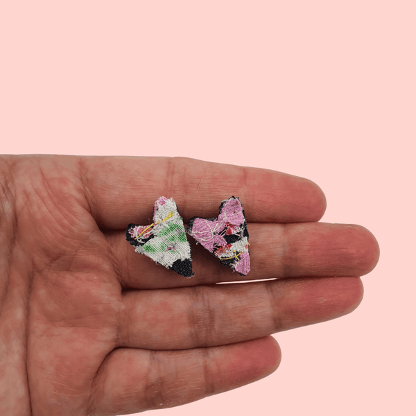 a pairs of small heart shaped stud earrings. pink, yellow and green textile created with scraps of fabric. 