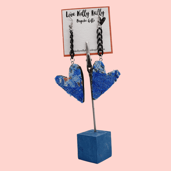 Blue heart dandle earrings with a black chain hanging on a love kelly reilly bespoke gifts branded card