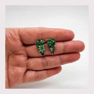 Tiny green leaf shaped fabric stud earrings.