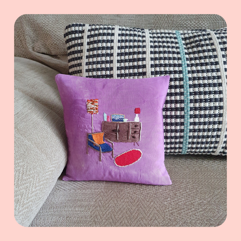 Cushion, pillow. Tie-dyed, up-cycled fabric cushion cover with retro hand embroidered living room scene