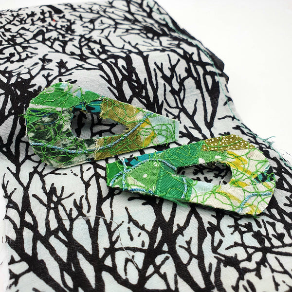 Two 80's design fabric brooches made with a mixture of different shades of greens