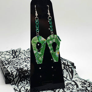 Dangle earrings with green chain in an abstract leaf design.