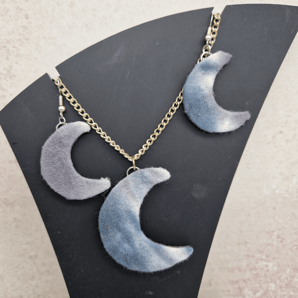 Grey and white moon shaped necklace and dangle earring set.