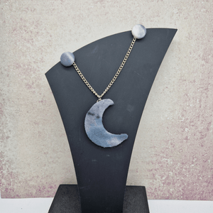 Grey and white moon shaped necklace and button earring set.