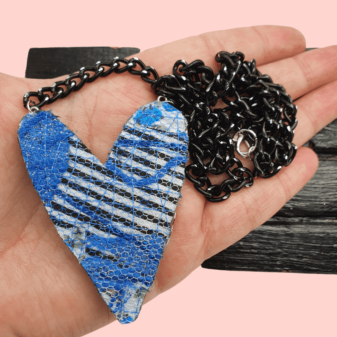 Blue heart necklace on a black curb chain