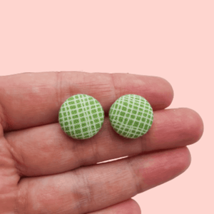 Green and white button studs.