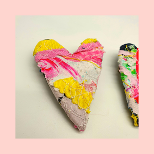  heart shaped fabric brooches  created using scrap fabrics. pinks and yellows with a black back.