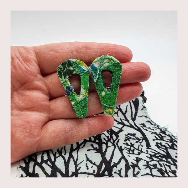 large green leaf shaped fabric stud earrings.