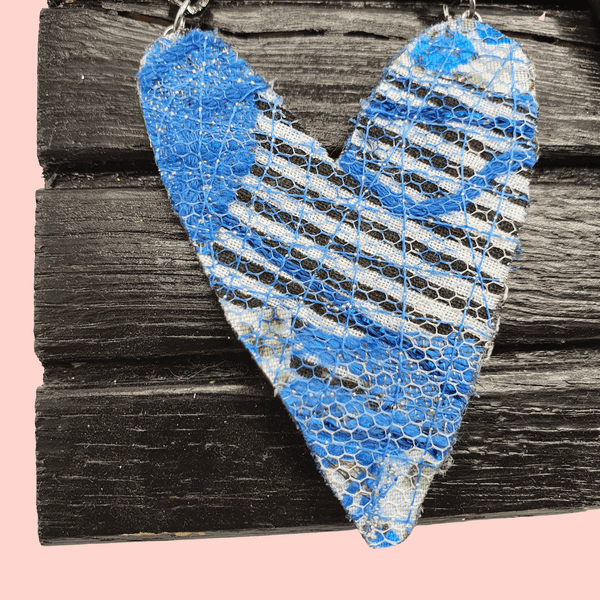 Blue and white heart necklace on a black curb chain