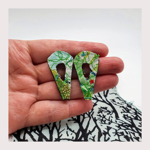large green leaf shaped fabric stud earrings.