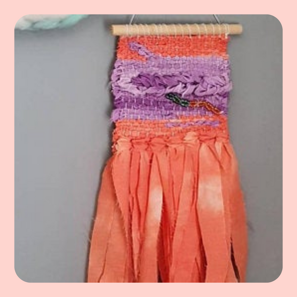 Hand woven wall hanging. Orange and purple Tie-dyed fabric and beading. Boho design.