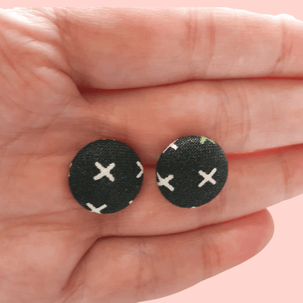 Button stud earrings, edgy cross design.