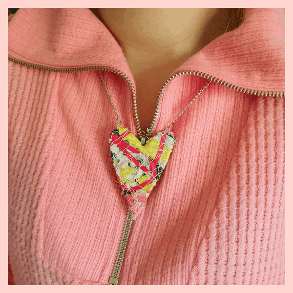 Pink ribbon and yellow upcycled fabric necklace.