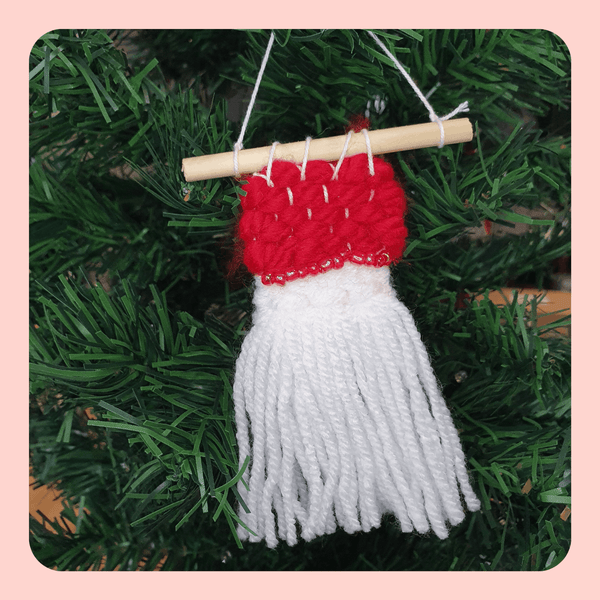 Mini Festive tree decoration. Red and white weaving with bead detail.