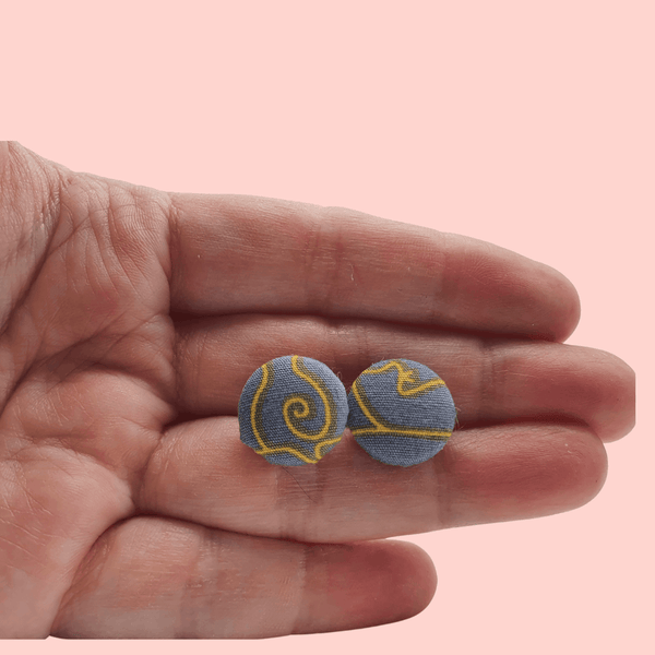 Grey fabric button studs with yellow cat design.