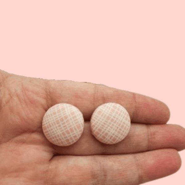 Pink and white lined button studs.