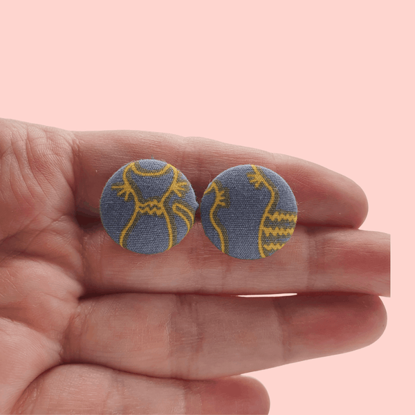 Grey fabric button studs with yellow cat design.