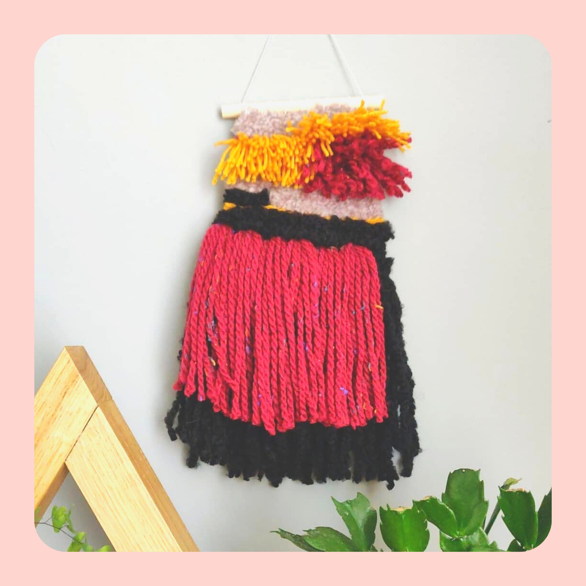 Red, black and yellow Woven wall hanging.