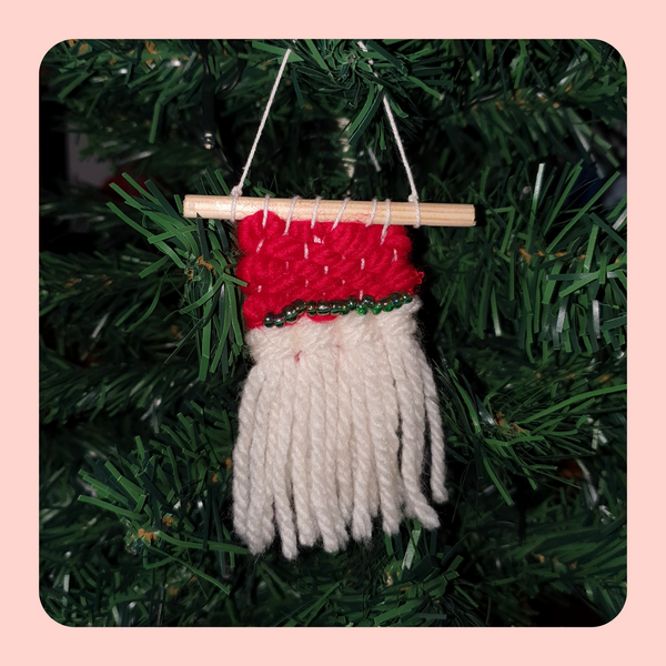 Mini Festive tree decoration. Red and white weaving with green bead detail.