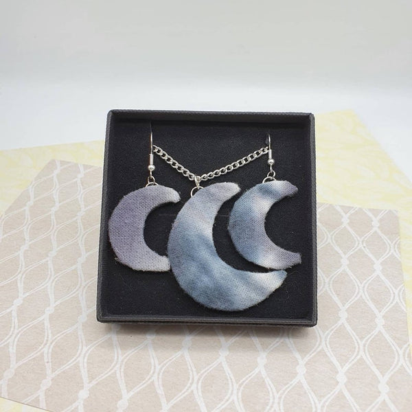 Grey and white moon shaped necklace and dangle earring set.